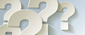 FAQ image with question marks in front of a grey wall