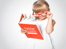 young girl holding a fletcher insulation book with a red book background